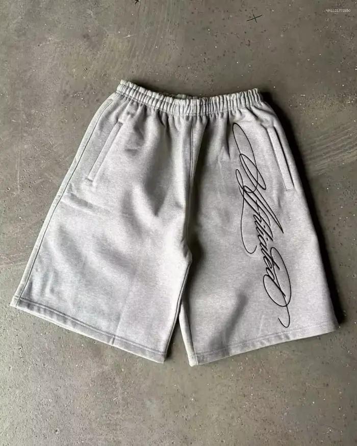 Shorts de sport gris surdimensionnés, longueur genou, avec imprimé signature en cursive, style stree