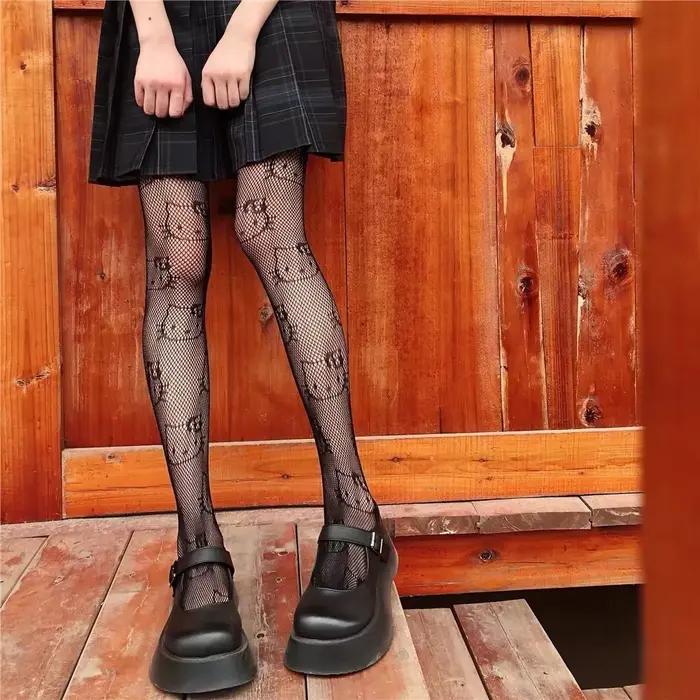 Bas fins japonais Hello Kitty pour femmes, chaussettes noires, filet de pêche, collants astronomiques anti-crochet, mignon, printemps, automne