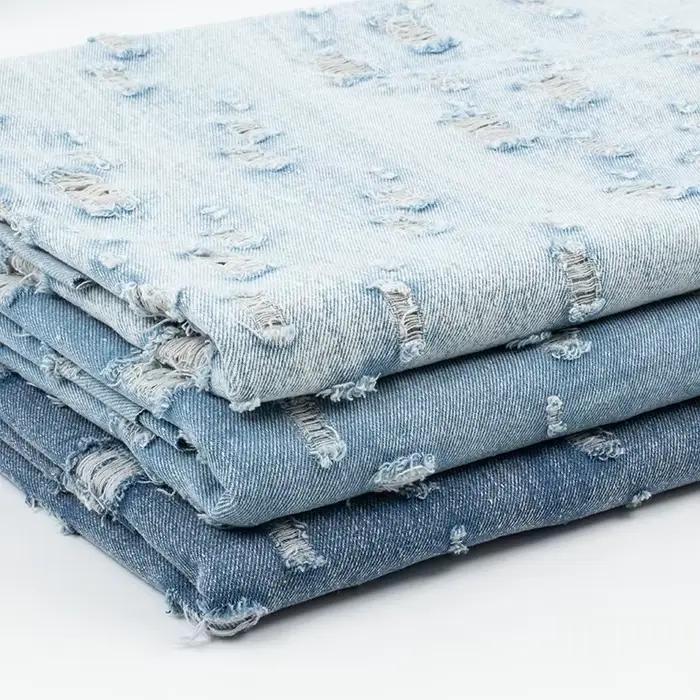 Tissu denim lavé blanc endommagé