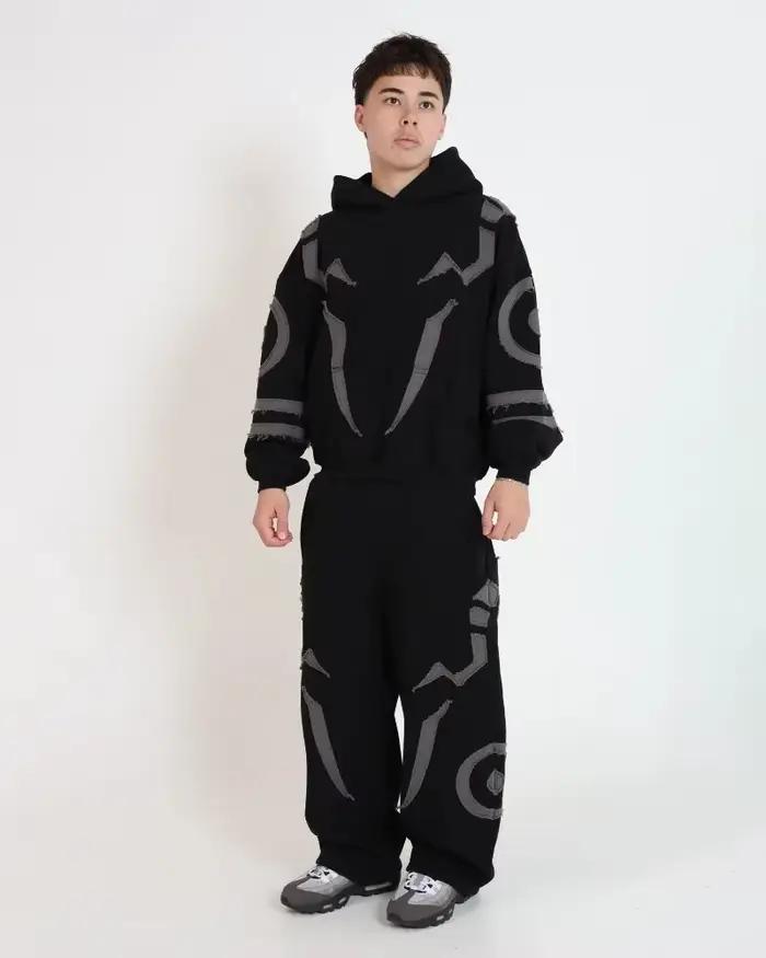 Ensemble sweat-shirt à capuche noir inspiré de la mode masculine et pantalon de jogging streetwear avec empiècements contrastants