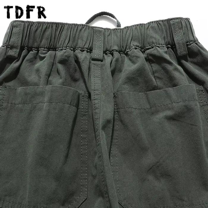 Couleur unie Cargo Joggers pantalon hommes épissé rétro Style Safari taille élastique jambe large Baggy
